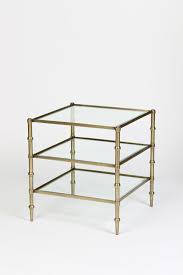 Metal accent tables are available the basic round shape can be stretched into an oval and the traditional square can be turned into a rectangle. Tiered Square Glass Accent Table In Antique Brass Finish Boulevard Urban Living