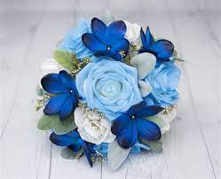 When it comes to spring summer color combinations, blue and pink is not that common, but it really does go together quite nicely. Blue Plumerias And Roses Wedding Real Touch Flower Bouquet Seashells Starfish Turquoise A Real Touch Wedding Flowers Silk Flower Bouquets Blue Flowers Bouquet