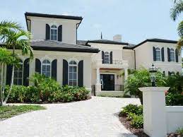 As proof, the show mythbusters did an experiment with two and much of the black paint on these houses are covering materials such as cedar shingles and if you're drawn to dark colors, add drama to your exterior with grays and dark blues that, unlike black. Stylish Home Black And White House Exterior Design White Exterior Houses White House Black Shutters Black And White House Exterior