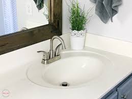 Framing your vanity mirror is an instant way to elevate the space. Farmhouse Style Fixer Upper Bathroom On A Budget Must Have Mom