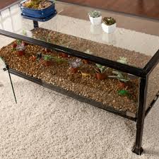 Family movie night is easier with a convenient place for the drinks and snacks, and a quiet afternoon with a cup of coffee or tea is more enjoyable with a coffee table equipped with a stack of books or newspapers. Showcase Terrarium Cocktail Table Black Walmart Com Walmart Com