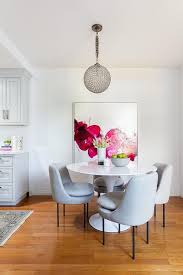 Styled Dining Room Designed With A White Tulip Table And Dove Gray Dining Chairs Tulip Dining Table White Dining Chairs Gray Dining Chairs