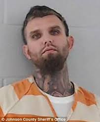 FIFTY-SEVEN white supremacist gang members charged over huge meth ring