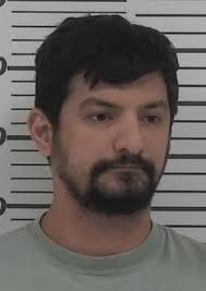 Ruslan Huseynov has been charged with second-degree murder, unlawful use of  a weapon and two counts of armed criminal action in the Jan. 10 shooting  death of Citizen sports reporter Dennis Sharkey.