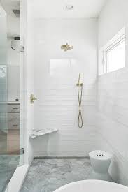 Stunning Seamless Glass Shower Boasts White Glass Stacked Tiles Fitted With A Bras Shower Kit Located Over White Bathroom Tiles Farmhouse Shower Tile Bathroom