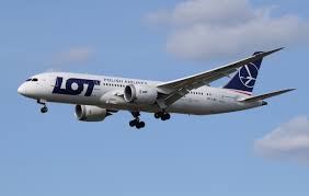 LOT Polish Airlines plane in flight, symbolizing easy booking changes. 