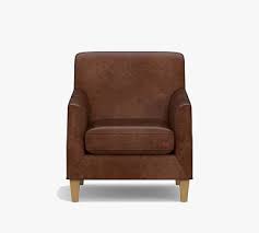 A brown leather chair is always classic, while black leather looks sleek. Toulouse Leather Armchair Pottery Barn