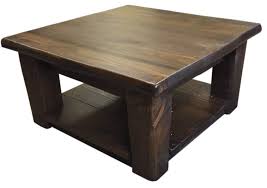 The coffee table has a rustic and natural style; Tree Fever Designs Custom Furniture Built On Vancouver Island