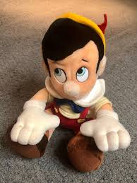 Vintage Pinocchio Sitting Plush Stuffed Animal From Disneyland Walt Disney World Measures 12 Tall Plush Stuffed Animals Disney Toys Disney Stuffed Animals