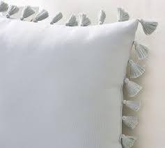 Throw pillows are a brilliant and easy way to change the look of a couch, chair or other furniture piece in the home or office. Tassel Trim Indoor Outdoor Pillows Pottery Barn