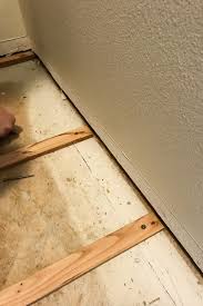 How To Fix An Uneven Subfloor Diy Home Improvement Installing Laminate Flooring Waterproof Laminate Flooring Best Flooring