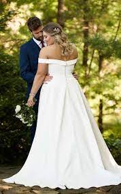 From haute couture gowns to simple, timeless silhouettes; Classic Satin Plus Size Ballgown With Pockets Off The Shoulder Sleeves Essense Of Australia Wedding Dresses Satin Wedding Gown Essense Of Australia Wedding Dresses Wedding Dress With Pockets