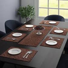 Like the cherry on top of a sundae, a good table runner can go a long way to turn your usual dining room set up into a display guests and family will be quick to flock to. Pablo Table Mats Set Urban Ladder