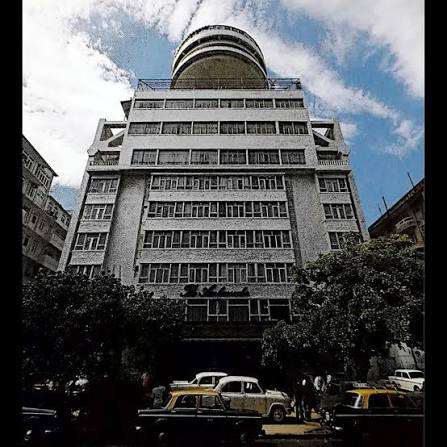 When Regal Cinema first opened its Art Deco doors in 1933, it was Bombay's very first air-conditioned theatre — all velvet seats and cinematic grandeur. Image 1: Back then, Colaba's streets were
