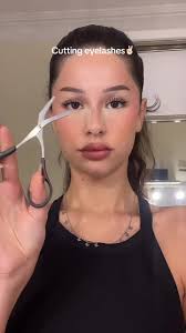 Girl Cutting Her Eyelashes