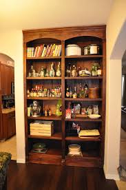 A few years ago when we decided to build a new home, we hired an architect to draw up custom plans for our home based on some variations of homes we had seen and toured. This Secret Door Bookshelf Opens Up To An Impressive Liquor Closet Buzznick