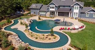 Freeform Pool Featuring A Lazy River Raised Spa And Oversized Tanning Ledge Freeformpool Lazyriver Dream Pools Pool Houses Backyard Pool