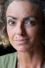 bend woman sues permanent makeup artist