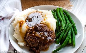 Per the united states department of agriculture standards, salisbury steak must have a minimum meat content of 65% although up to 25% can be pork. Easy Salisbury Steak Recipe Little House Big Alaska