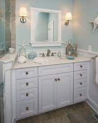 Walls of sky blue glass subway tiles give off the reflective qualities of water in this simple bathroom. Light Blue Small Bathroom Ideas Trendecors