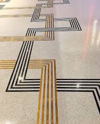 Terrazzo Embedded With Brass And Black Strips Terrazzo Terrazzo Flooring Inlay Flooring Floor Design