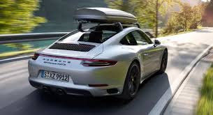 It fits and fills in the cargo bed. Porsche Design S New Roof Boxes Look Sleek Even On A 911 Carscoops