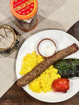 Juicy Kebab Koobideh with saffron rice, AI generated