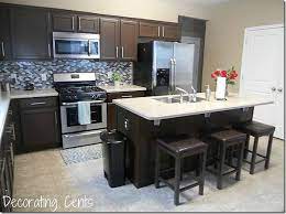 Painting kitchen cabinets can update your kitchen without the cost or challenge of a major how i painted my kitchen cabinets. Remodelaholic Sleek Dark Chocolate Painted Cabinets Brown Kitchen Cabinets Home Kitchens Dark Brown Kitchen Cabinets