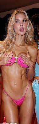 Joy Corrigan flaunts curves in a series of barely there bikinis for  swimwear fashion show in Miami | Daily Mail Online