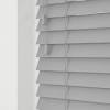 Layering the window treatments is a good way to keep the functionality of the blinds but add some color and texture with curtain panels. 1