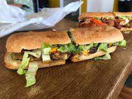 17.00 hot fried chicken thigh, lemon slaw, sweet pickle, honey mustard mayonnaise, on a freshly baked brioche bun. We Tried Every Sandwich On The Menu At Earl Kaka Ako
