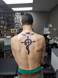 Elric On Twitter Fullmetal Is Officially Tagged Got The Flamel Symbol On Edward S Cloak A Symbol Of Healing And Warding Off Illness I Get A Tattoo Around This Time Every Year Or The flamel refers to the mystical and alchemical symbol depicted as a cross with a snake or serpent draped about it, as well as detached wings and a crown above it. fullmetal is officially tagged got the