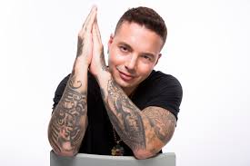 The tattoo begins from his left shoulder and tattoo: Singer Jay Balvin With Tattoos On His Hands Wallpapers And Images Wallpapers Pictures Photos