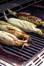 Add the corn ears with he husks and soak for 10 minutes. How To Grill Corn In The Husk Sinful Nutrition