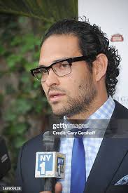 New York Jets' Mark Sanchez, Larry Ehrlich, Chairman of the Board,... News  Photo