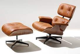 A high detail curved lying lounge chair. 10 Iconic Lounge Chairs With Footstools