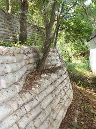 Just Stack Up Bags On Concrete Leave Them As Is Through A Few Big Rains Ir Thoroughly Soak A Fe Concrete Retaining Walls Backyard Landscaping Retaining Wall