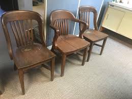 Three Antique Wooden Chairs Made By The Milwaukee Chair Company Two Of The Same Design And One Of A Different Design Antique Wooden Chairs Bankers Chair Chair