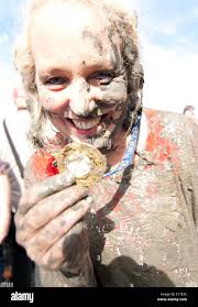 Maldon, UK. 25th May, 2014. Debbie Douglas Former Towie star shows off her  Maldon Mud Race Medal. UK. Credit: Tony Worpole/Alamy Live News Stock Photo 