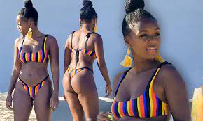 Janelle Monae showcases her flawless figure in a skimpy striped bikini as  she frolics on the sand | Daily Mail Online