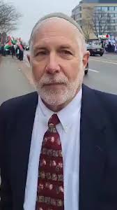 Rabbi David Mevaser, a member of Independent Jewish Voices Canada, protests  the sale of properties built