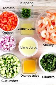 Place shrimp in a glass bowl and cover with lime juice to marinate (or 'cook') for about 10 minutes, or until they turn pink and opaque. Shrimp Ceviche Recipe Mexican Style Lemon Blossoms