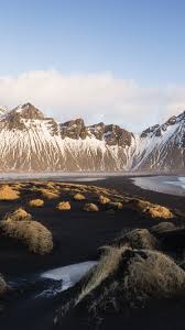 Choose any iphone walpaper wallpaper for your ios device. Iceland Vestrahorn Coast Sea Grass Mountains 750x1334 Iphone 8 7 6 6s Wallpaper Background Picture Image