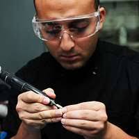 Hospital Corpsman 1st Class Vladimir Pierre-Charles, from Amityville, N.Y.,  and Hospital Corpsman 2nd Class Lauren Coons, from Philadelphia, document  Sailors shot records aboard the aircraft carrier USS Dwight D. Eisenhower  (CVN 69). -