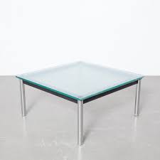 The 15mm thick clear glass top rests on a black enameled steel frame and tubular steel frame legs. Lc10 P Coffee Table By Le Corbusier For Cassina 1980s 161555