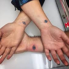 Beautiful evil eye reflection in water tattoo design by simplytattoo Evil Eye Tattoo Designs Picks A Good One Body Tattoo Art