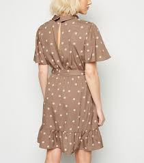 For some added edge, wear this skirt with a moto jacket for an unforgettable concert 'fit. Petite Camel Spot Roll Neck Dress New Look