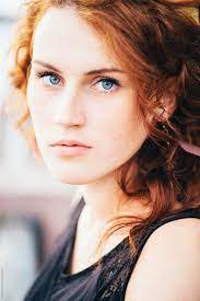 For example, fair skin with dark brown hair and bright blue eyes. Young Woman With Red Hair And Blue Eyes By Michela Ravasio