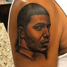 A woman walks into an la tattoo shop and says, i want you to tattoo 'drake' across my forehead.. Drake S Dad Just Tattooed His Son S Face On His Arm People Com