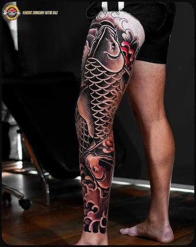 A full leg Japanese traditional tattoo with waves inspired by the ocean and surfing 🌊 The flowers represent his mum & dad's love for gardening, while the koi fish honor his grandma